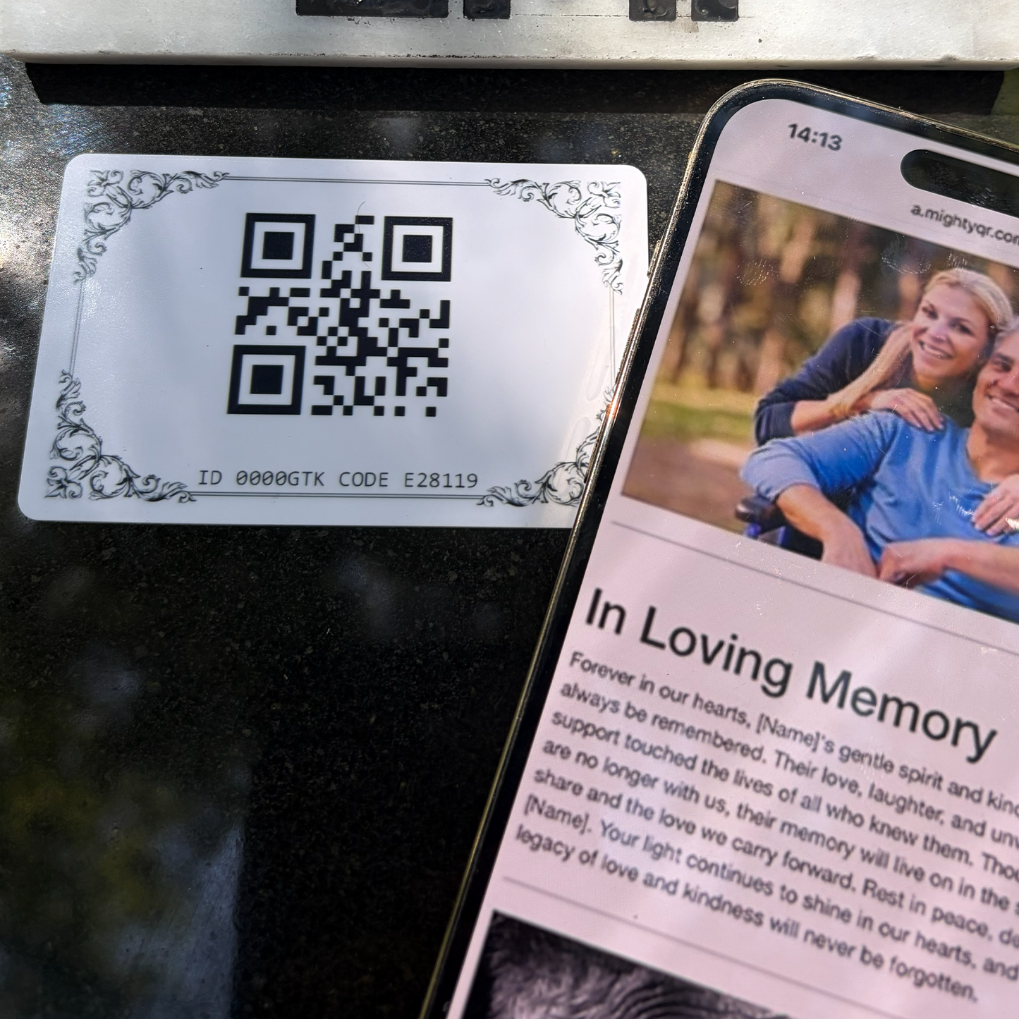 Close up of memorial qr card near marble and phone